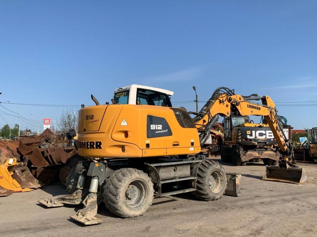 2015 Liebherr A912 Compact wheel excavator, rear three-quarter view 2015 Liebherr A912 Compact wheel excavator, rear three-quarter view