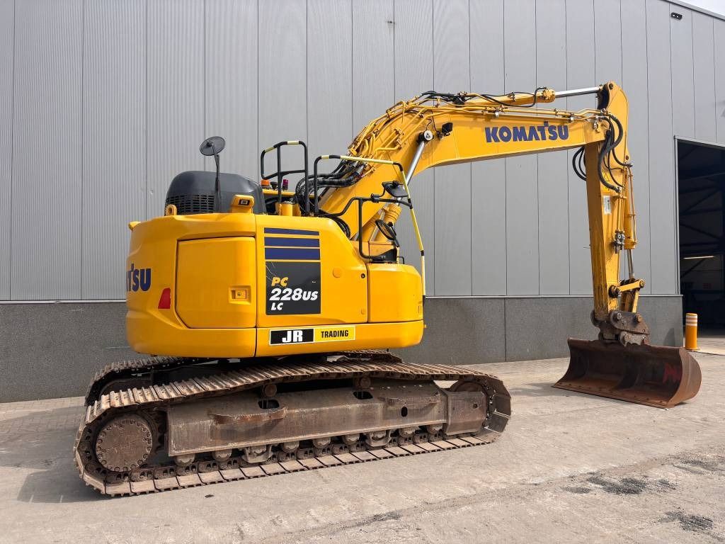 2020 Komatsu PC228USLC-11 crawler excavator, rear three-quarter view 2020 Komatsu PC228USLC-11 crawler excavator, rear three-quarter view