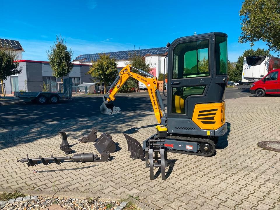 Kubota BK1250KSR mini excavator, side view with attachments Kubota BK1250KSR mini excavator, side view with attachments