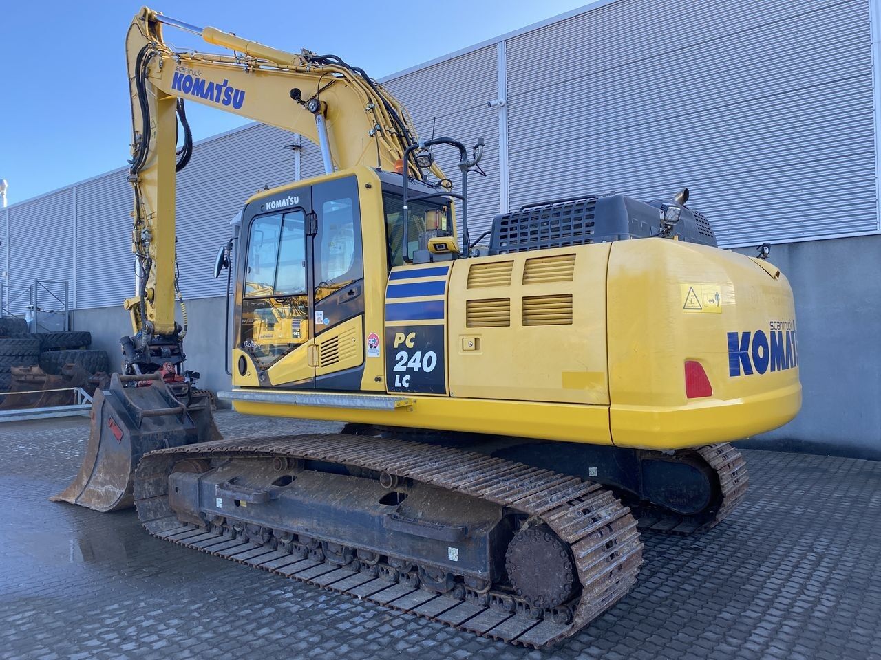 2018 Komatsu PC240LC-11 crawler excavator, rear three-quarter view 2018 Komatsu PC240LC-11 crawler excavator, rear three-quarter view