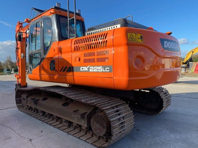 2017 Doosan DX225LC crawler excavator, rear three-quarter view 2017 Doosan DX225LC crawler excavator, rear three-quarter view