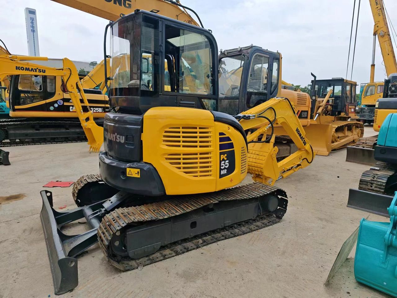 2018 Komatsu PC55MR-2 mini excavator, rear three-quarter view 2018 Komatsu PC55MR-2 mini excavator, rear three-quarter view