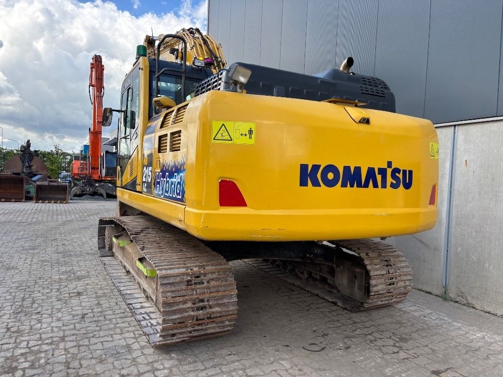 2021 Komatsu 215 Hybrid crawler excavator, rear three-quarter view