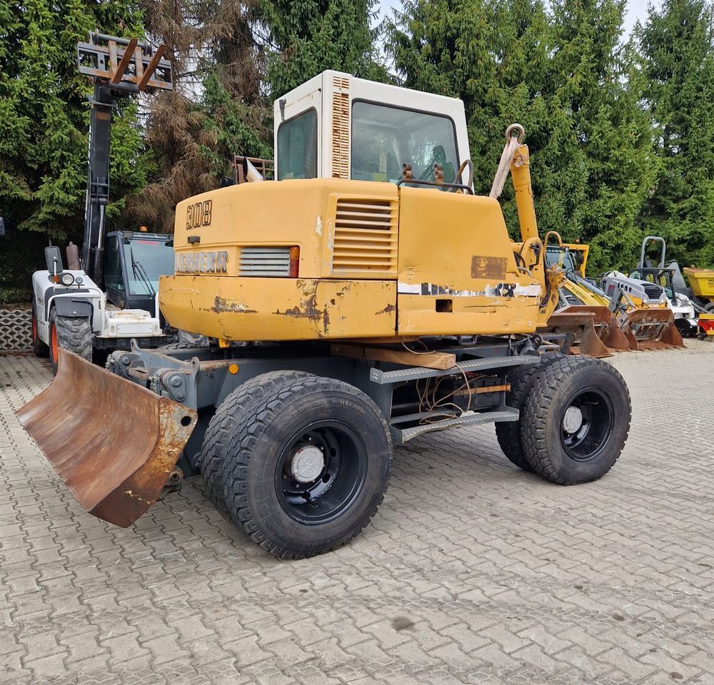 1999 Liebherr 308 wheel excavator, rear three-quarter view