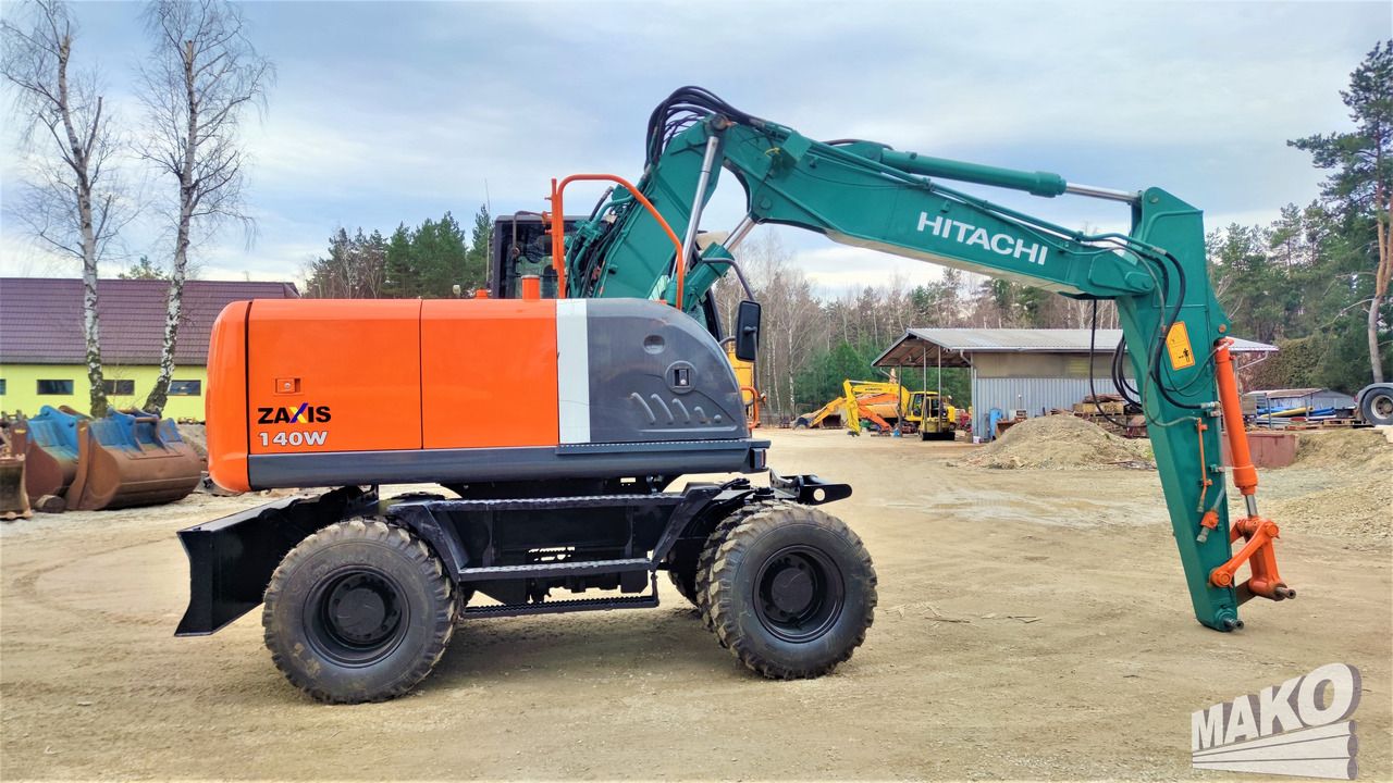 2012 Hitachi Zaxis 140W wheel excavator side view 2012 Hitachi Zaxis 140W wheel excavator side view