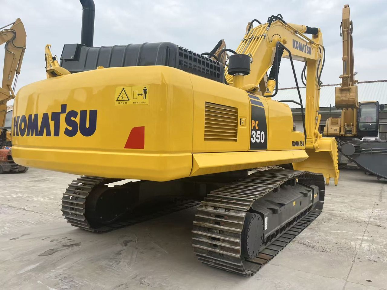 2023 Komatsu PC350 crawler excavator, rear three-quarter view 2023 Komatsu PC350 crawler excavator, rear three-quarter view