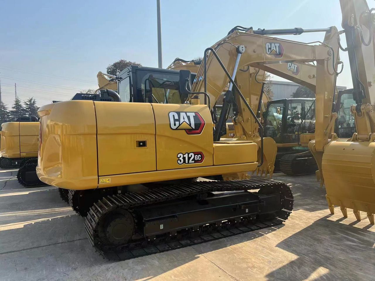 2026 Caterpillar 312GC crawler excavator, rear three-quarter view