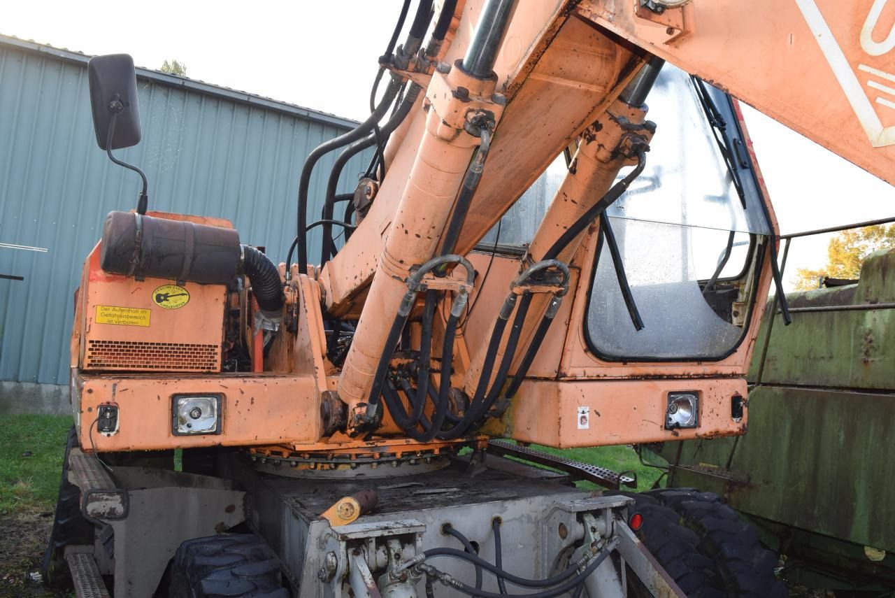 1990 O&K MH 5 wheel excavator, close-up of cab and boom 1990 O&K MH 5 wheel excavator, close-up of cab and boom