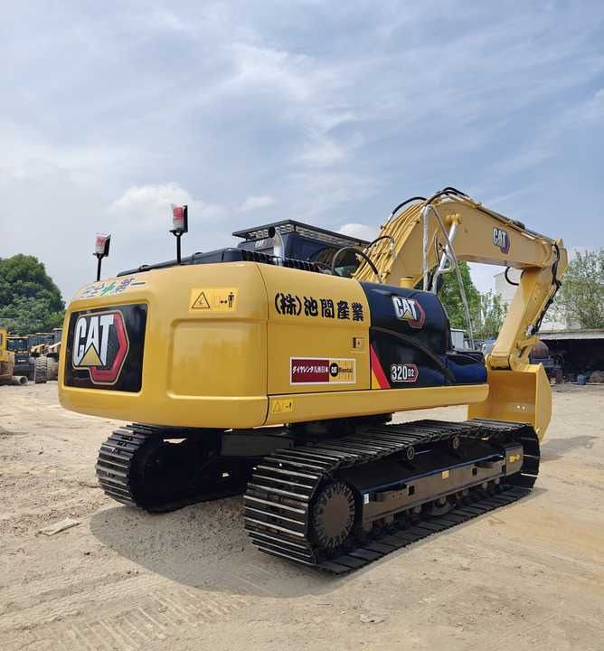 Caterpillar 320GC crawler excavator, rear three-quarter view Caterpillar 320GC crawler excavator, rear three-quarter view