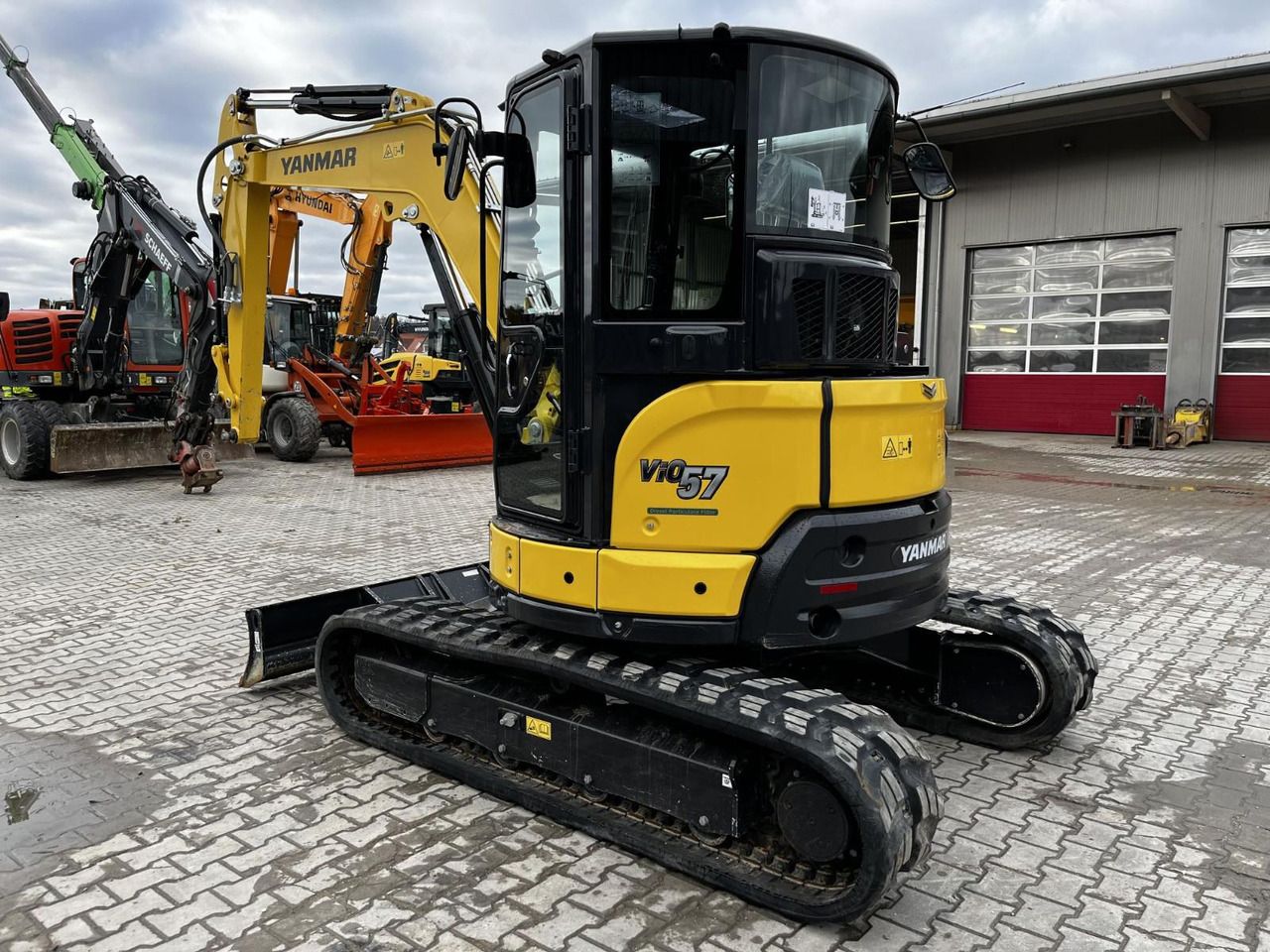 2021 Yanmar VIO57-6B mini excavator, rear three-quarter view 2021 Yanmar VIO57-6B mini excavator, rear three-quarter view