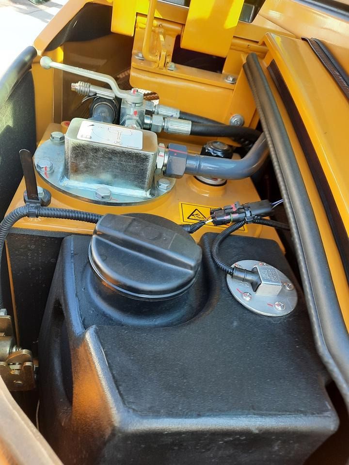 2023 Komatsu XE35E mini excavator engine compartment detail 2023 Komatsu XE35E mini excavator engine compartment detail