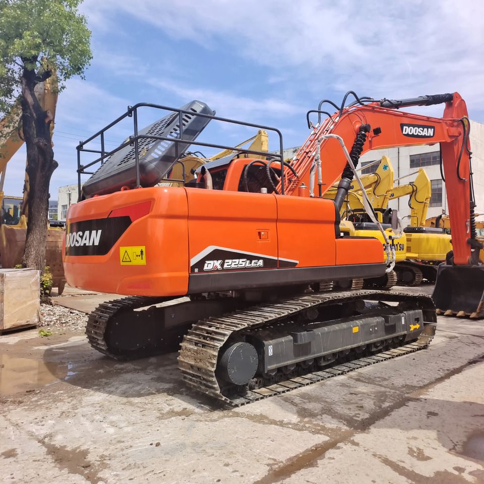 2024 Doosan DX225LCA crawler excavator, rear three-quarter view 2024 Doosan DX225LCA crawler excavator, rear three-quarter view