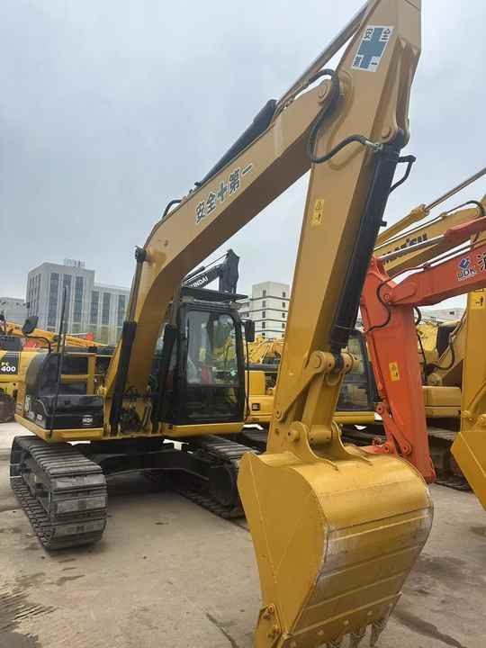 2013 Caterpillar 312D2 crawler excavator, side view 2013 Caterpillar 312D2 crawler excavator, side view