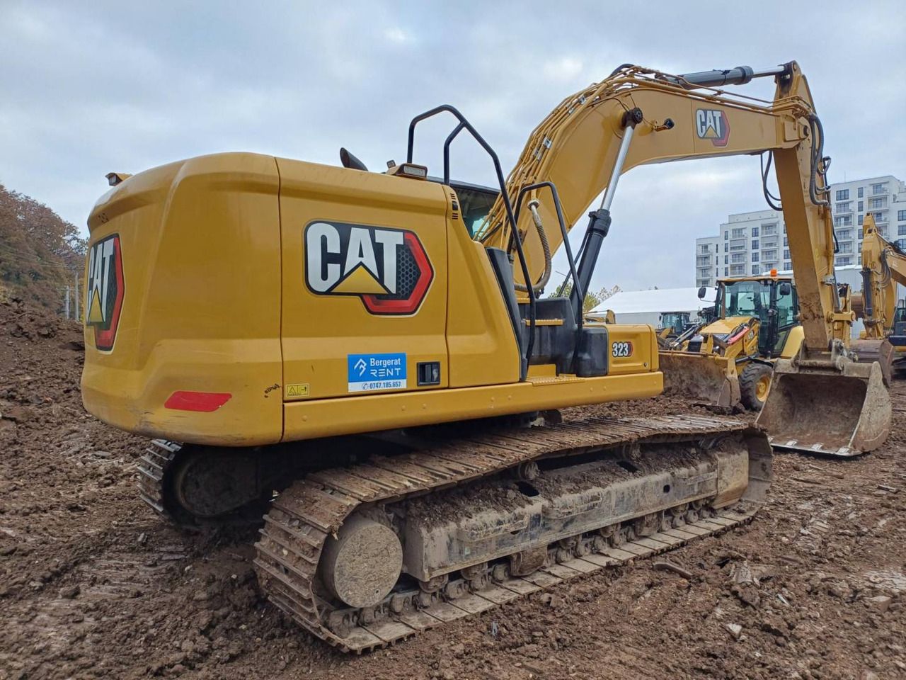 2024 Caterpillar 323-07 crawler excavator, rear three-quarter view 2024 Caterpillar 323-07 crawler excavator, rear three-quarter view