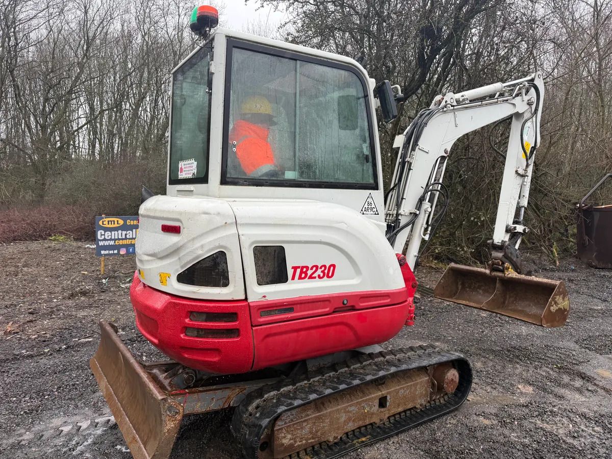 2018 Takeuchi TB230 mini excavator, rear three-quarter view 2018 Takeuchi TB230 mini excavator, rear three-quarter view
