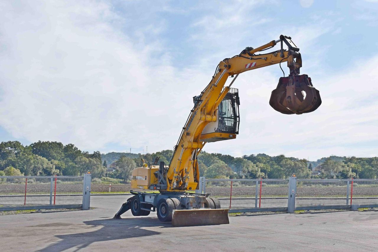 2008 Liebherr A316 wheel excavator, side view 2008 Liebherr A316 wheel excavator, side view