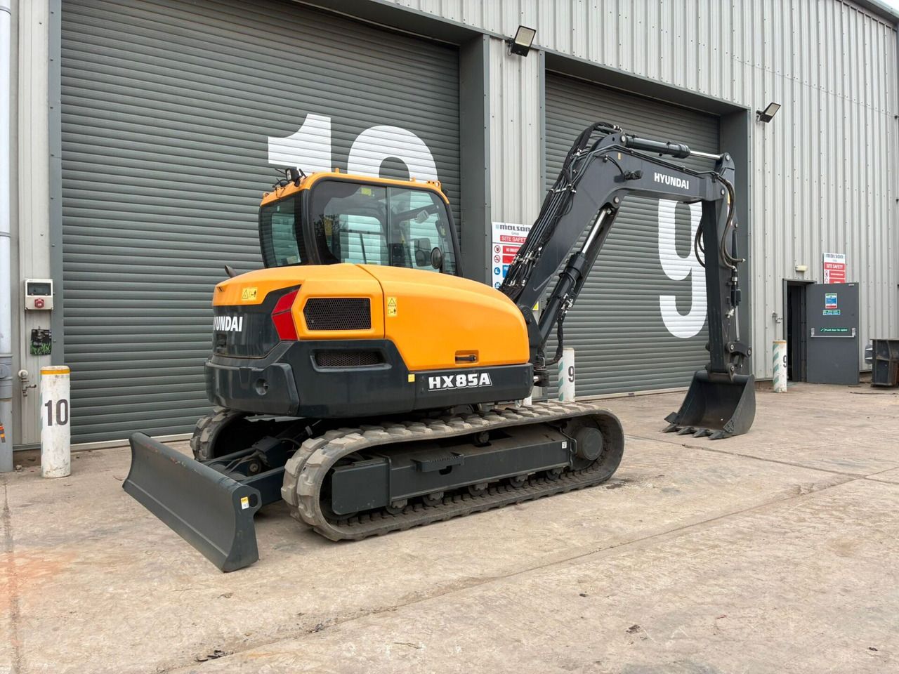 2023 Hyundai HX85A mini excavator, rear three-quarter view 2023 Hyundai HX85A mini excavator, rear three-quarter view
