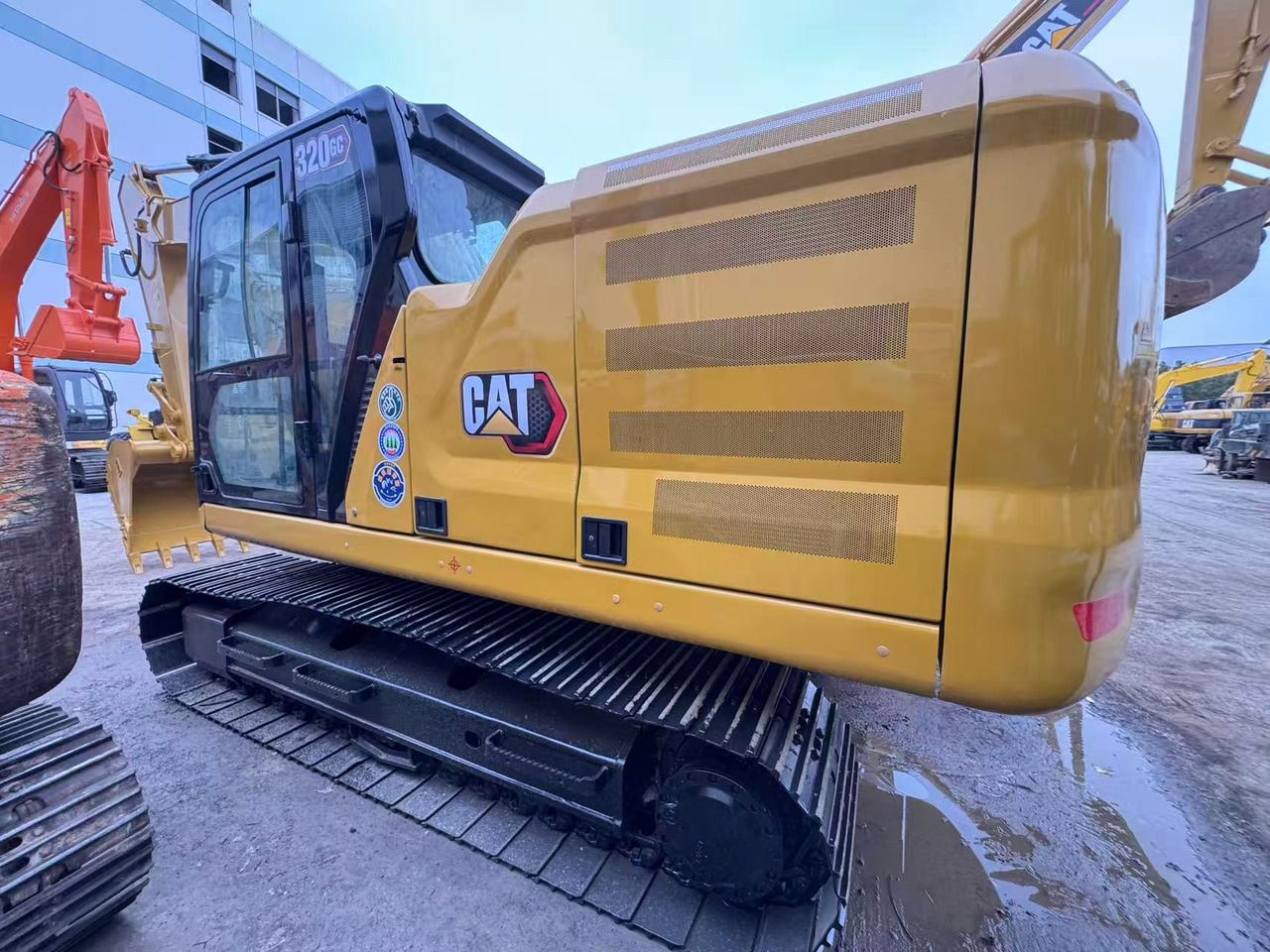 2024 Caterpillar 320GC crawler excavator, rear three-quarter view