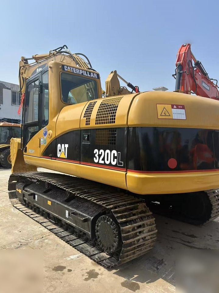 Гусеничний екскаватор 2024 Caterpillar 320CL, задній ракурс три чверті Гусеничний екскаватор 2024 Caterpillar 320CL, задній ракурс три чверті