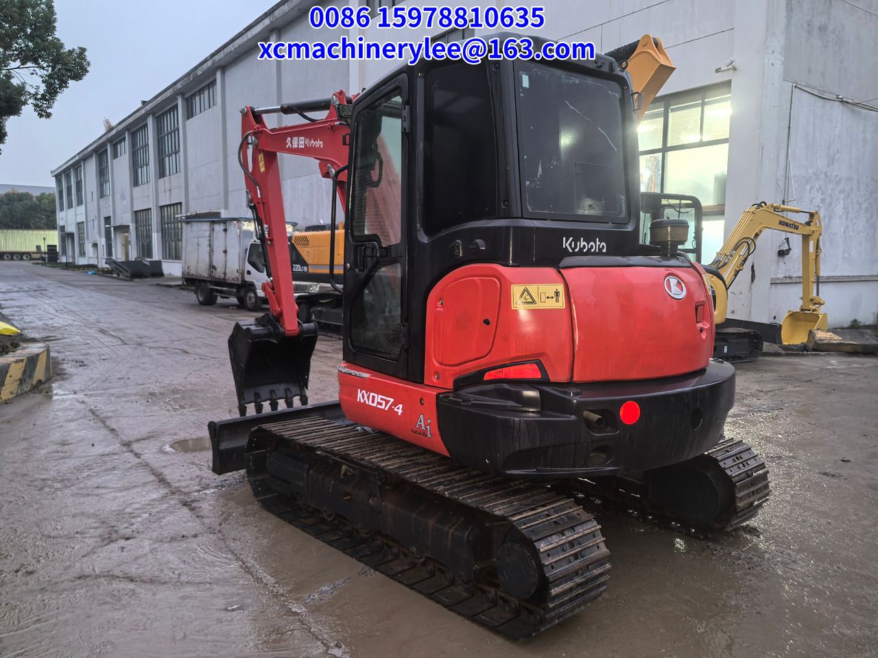 2023 Kubota KX057-4 mini excavator, rear three-quarter view