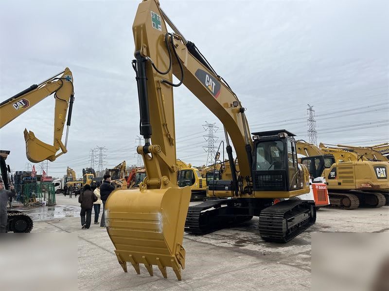 2024 Caterpillar 323D crawler excavator, front three-quarter view