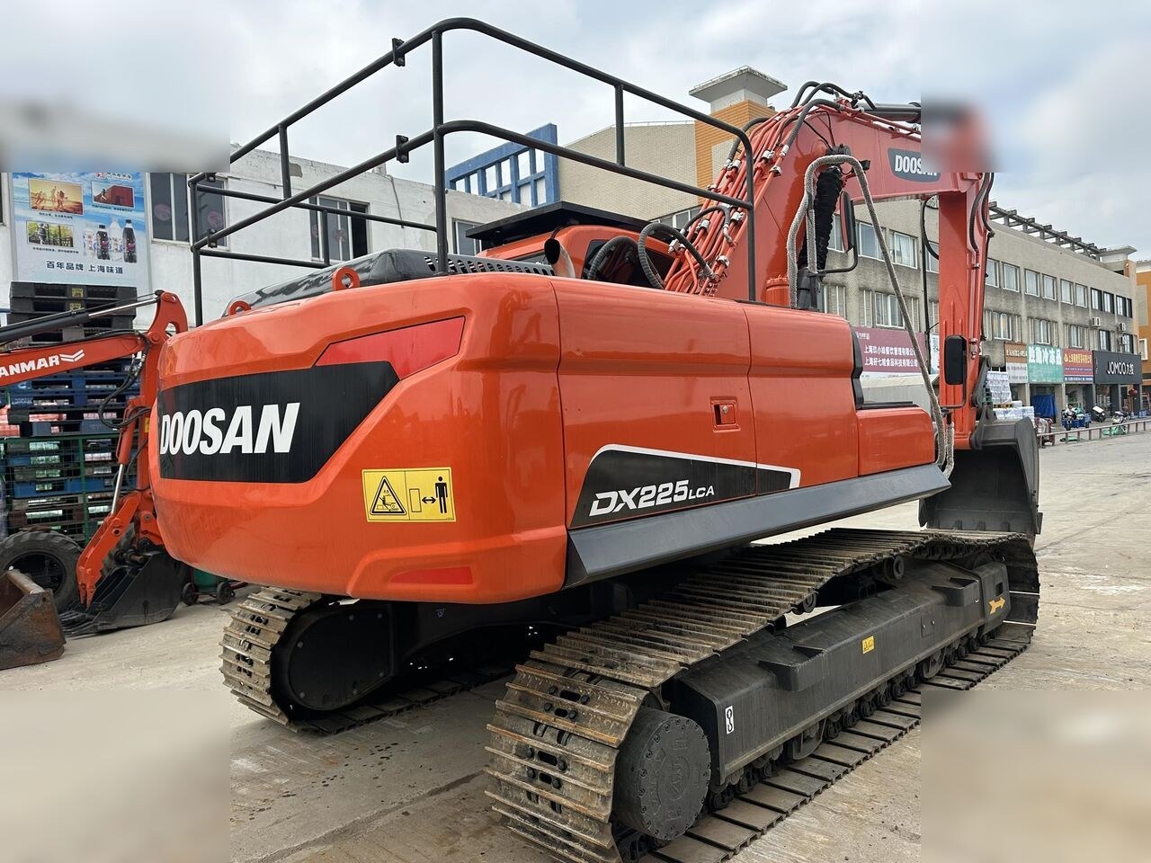 2024 Doosan DX225LCA crawler excavator, rear three-quarter view