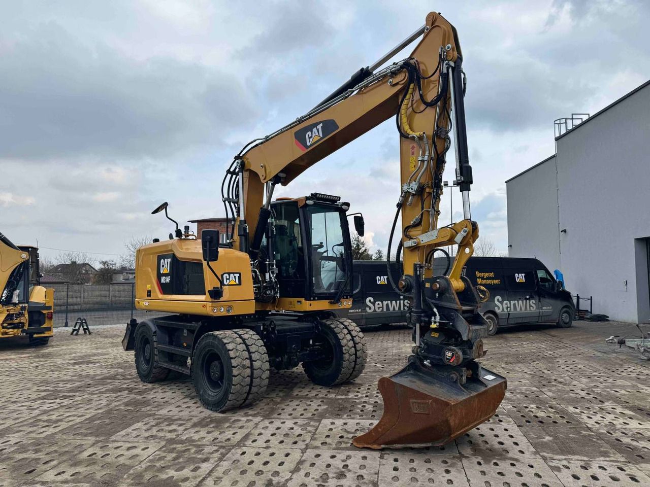 2019 Caterpillar M314F wheel excavator, front three-quarter view 2019 Caterpillar M314F wheel excavator, front three-quarter view