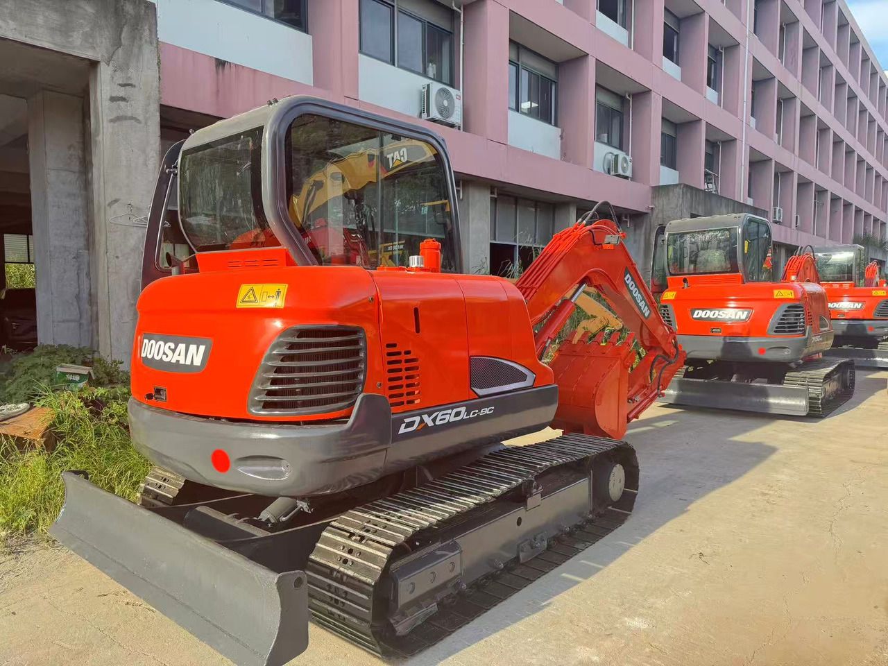 2022 Doosan DX60LC-9C mini excavator, rear three-quarter view 2022 Doosan DX60LC-9C mini excavator, rear three-quarter view