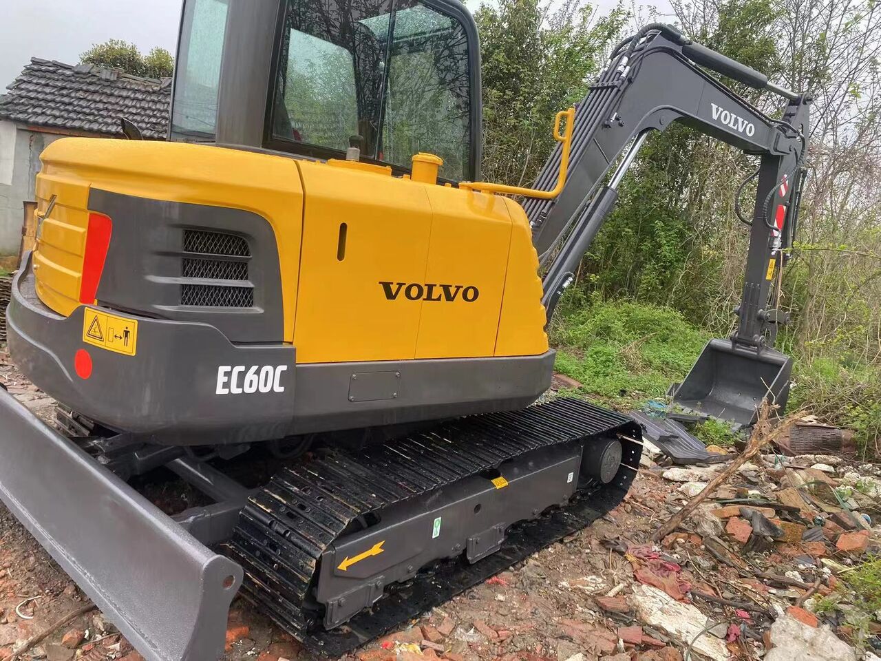 2023 Volvo EC60C mini excavator, rear three-quarter view