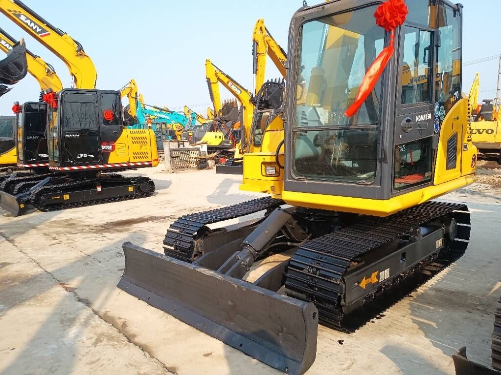 2025 Komatsu PC70 crawler excavator, front three-quarter view