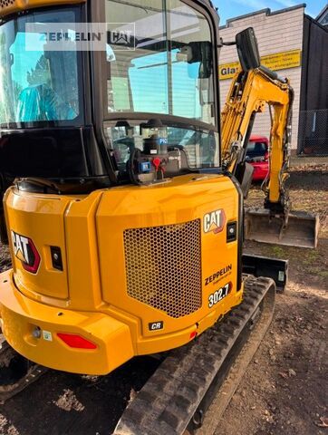 2023 Caterpillar 302.7CR mini excavator, rear three-quarter view 2023 Caterpillar 302.7CR mini excavator, rear three-quarter view