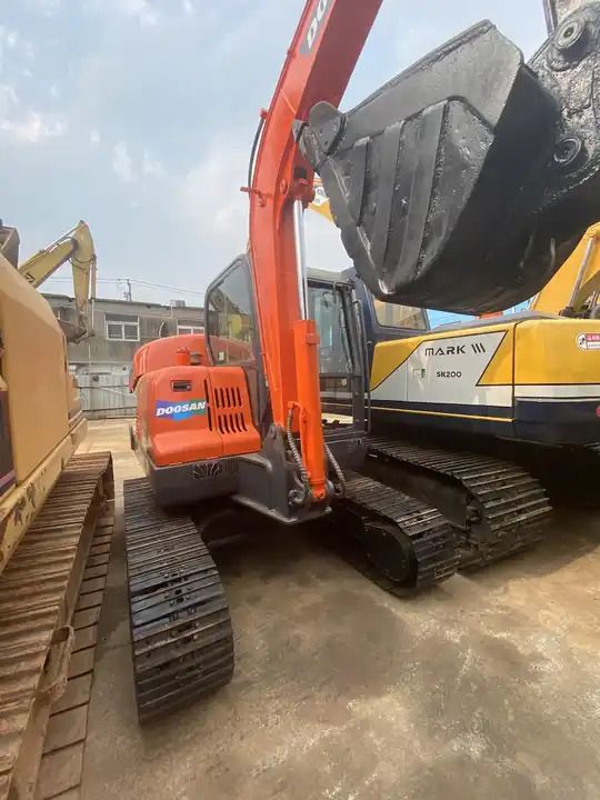 2019 Doosan DX55 crawler excavator, rear three-quarter view 2019 Doosan DX55 crawler excavator, rear three-quarter view