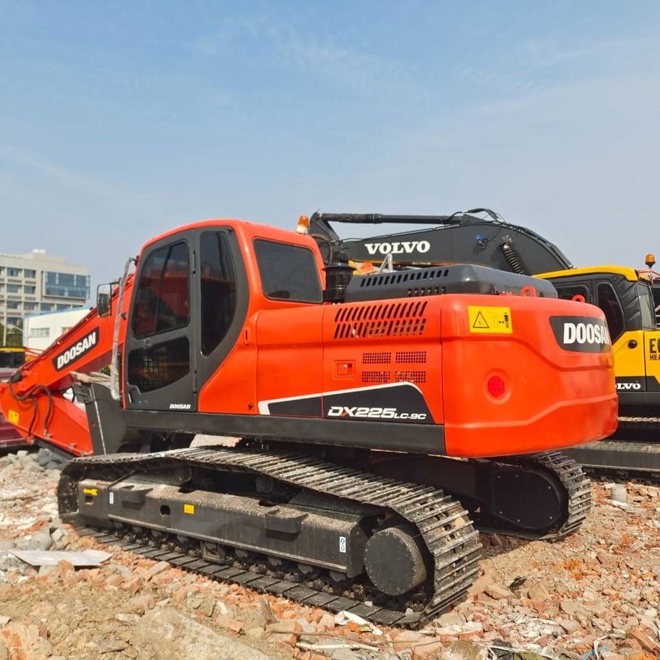 2024 Doosan DX225LC-9C crawler excavator, rear three-quarter view 2024 Doosan DX225LC-9C crawler excavator, rear three-quarter view