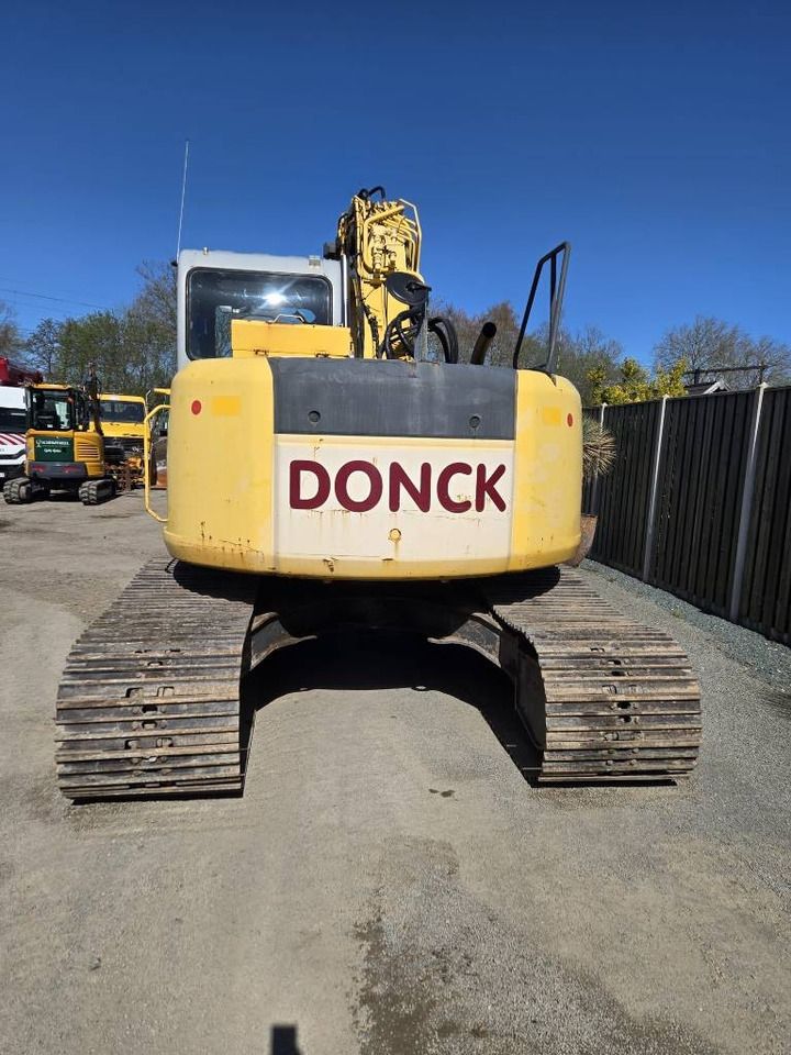 2006 New Holland E135SR-1E crawler excavator, rear view 2006 New Holland E135SR-1E crawler excavator, rear view
