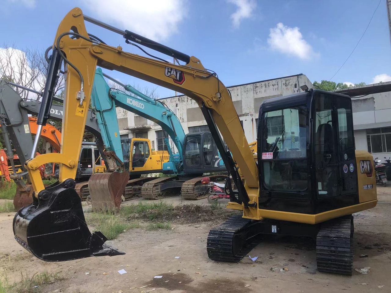 2011 Caterpillar 305.5E mini excavator, front three-quarter view