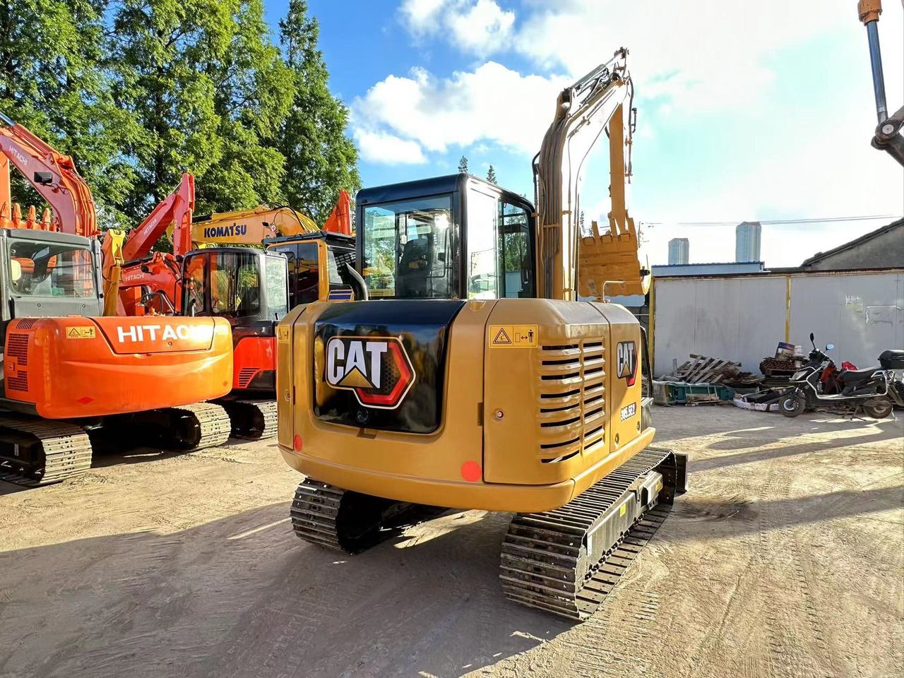 2022 Caterpillar 305.5E2 excavator, rear three-quarter view 2022 Caterpillar 305.5E2 excavator, rear three-quarter view