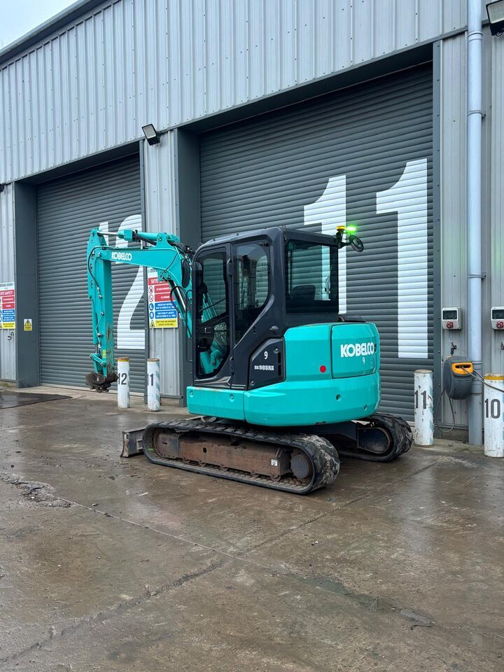 2023 Kobelco SK58SRX-7 mini excavator, rear three-quarter view 2023 Kobelco SK58SRX-7 mini excavator, rear three-quarter view