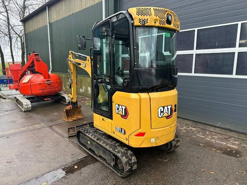 2021 Caterpillar 301.8 mini excavator, rear three-quarter view