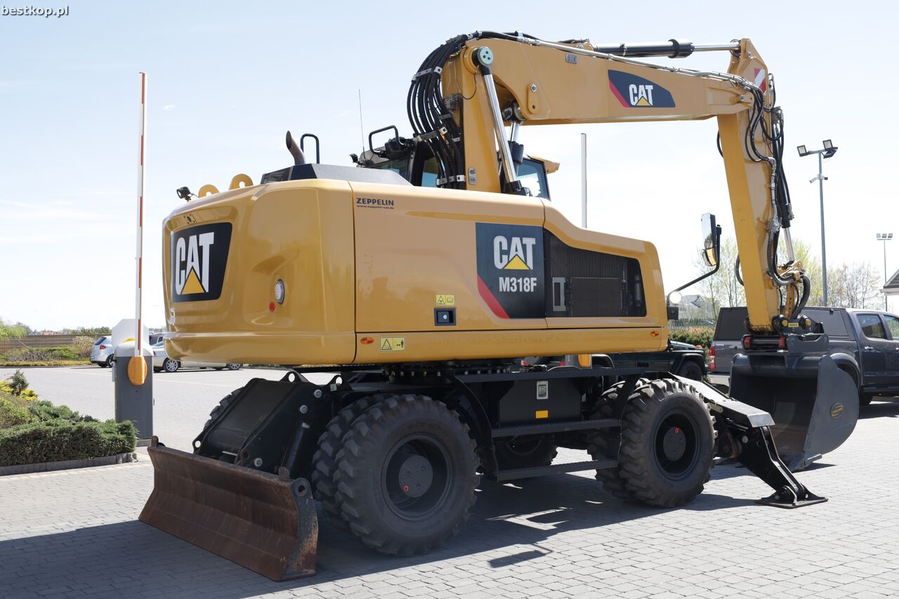 2016 Caterpillar M318F wheel excavator, rear three-quarter view 2016 Caterpillar M318F wheel excavator, rear three-quarter view