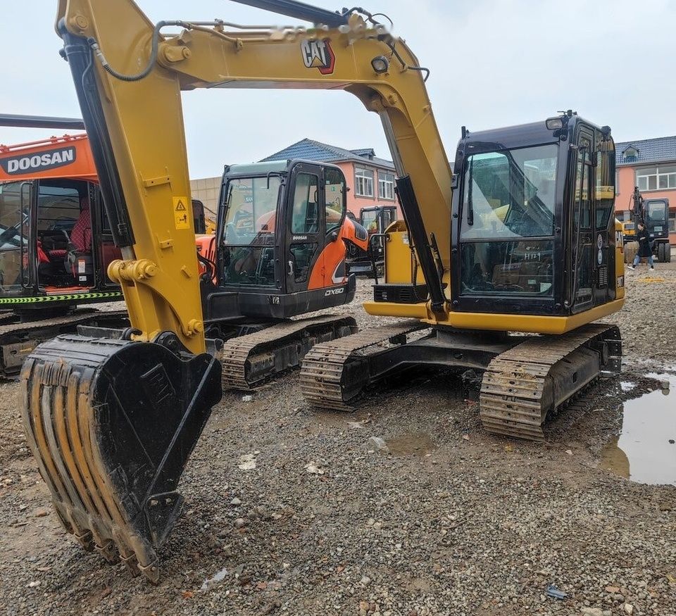 Caterpillar 307E mini excavator, front three-quarter view Caterpillar 307E mini excavator, front three-quarter view