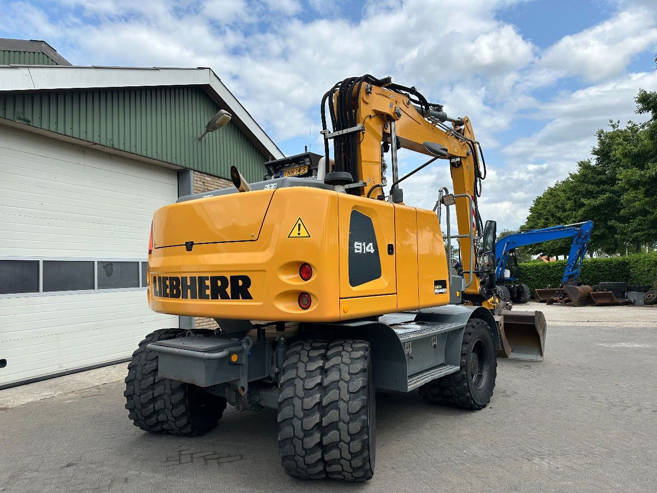2015 Liebherr A914 wheel excavator, rear three-quarter view 2015 Liebherr A914 wheel excavator, rear three-quarter view