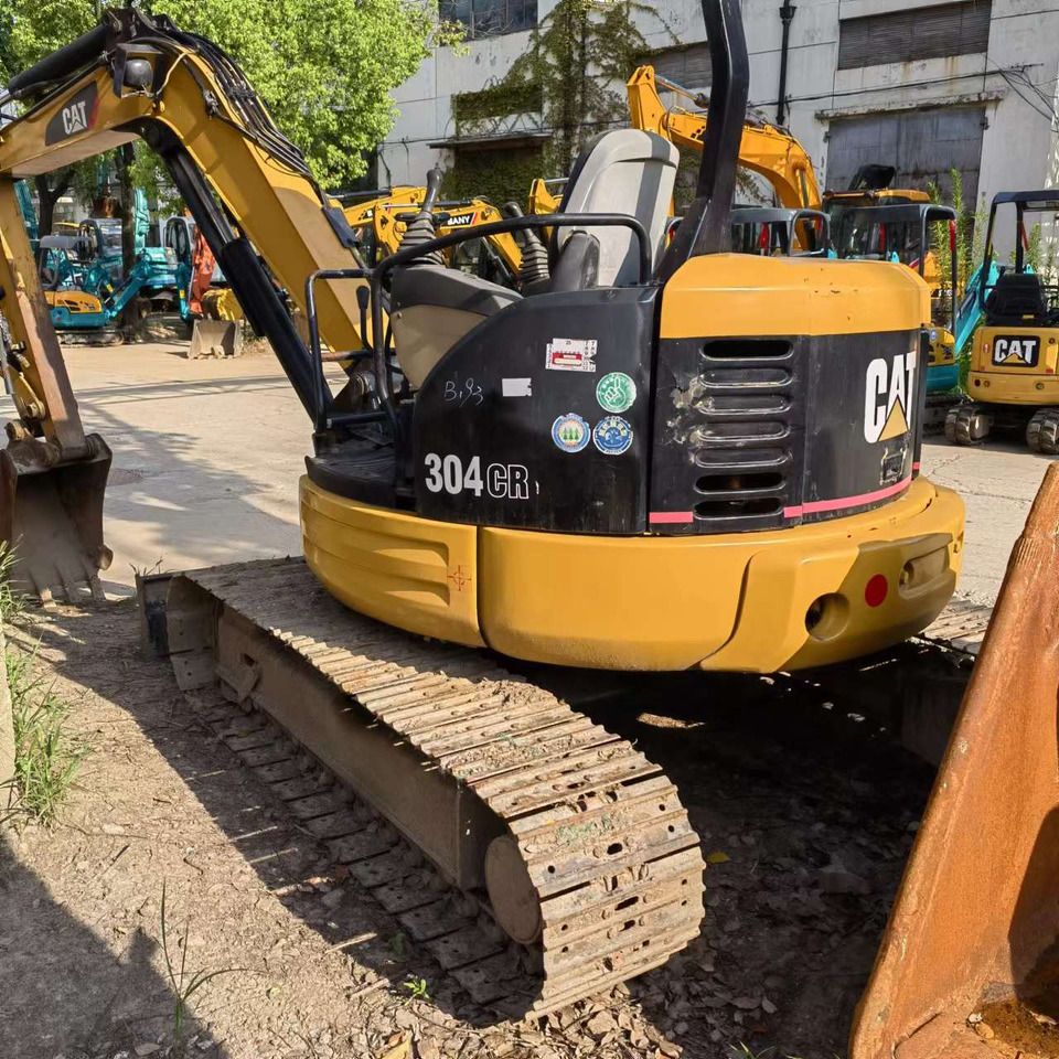 2023 Caterpillar 304CR mini excavator, rear three-quarter view 2023 Caterpillar 304CR mini excavator, rear three-quarter view