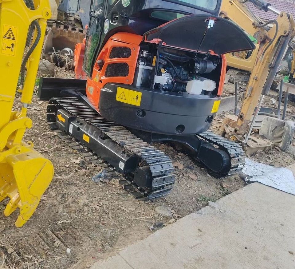 Kubota U-30 mini excavator, rear view with engine compartment open