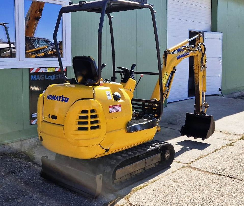 2002 Komatsu PC12R-8 mini excavator, rear three-quarter view 2002 Komatsu PC12R-8 mini excavator, rear three-quarter view