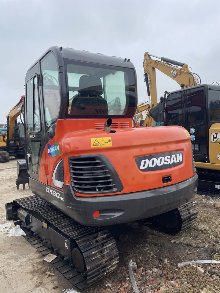 2023 Doosan DX60-9C mini excavator, rear three-quarter view