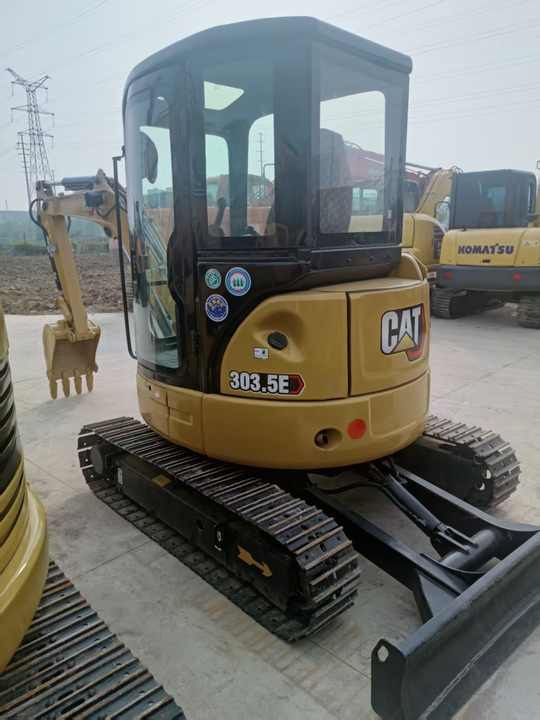 2023 Caterpillar 303.5E mini excavator rear three-quarter view