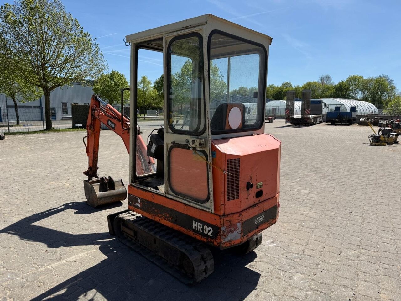 1990 Schaeff HR02 mini excavator, rear three-quarter view 1990 Schaeff HR02 mini excavator, rear three-quarter view
