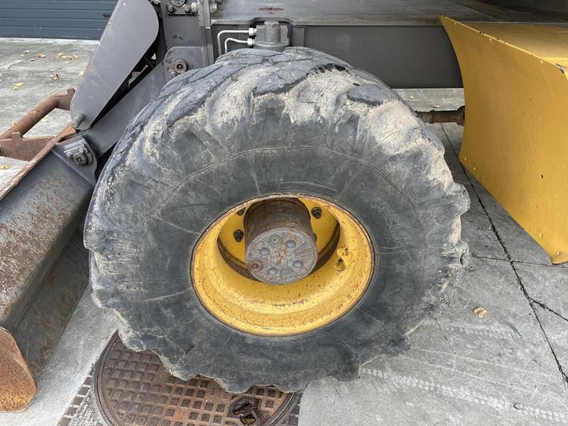 2007 Volvo EW140B wheel excavator tire and wheel detail