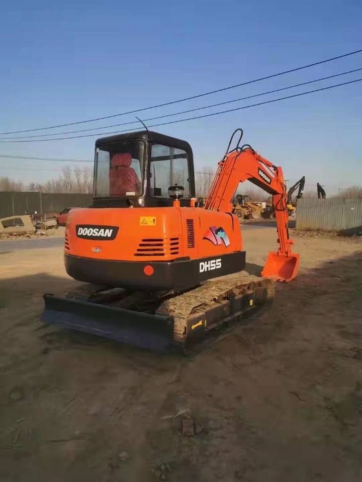 2023 Doosan DH55 mini excavator, rear three-quarter view