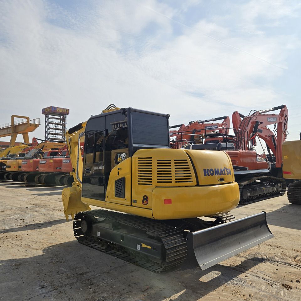Komatsu PC70-8 mini excavator, rear three-quarter view Komatsu PC70-8 mini excavator, rear three-quarter view